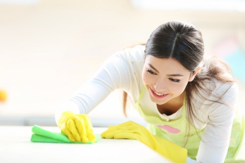 Cleaner vacuuming carpet as part of end of tenancy cleaning